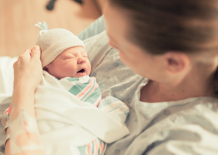 Mother,In,Hospital,Holding,Her,New,Born,Baby,Boy.,Birth